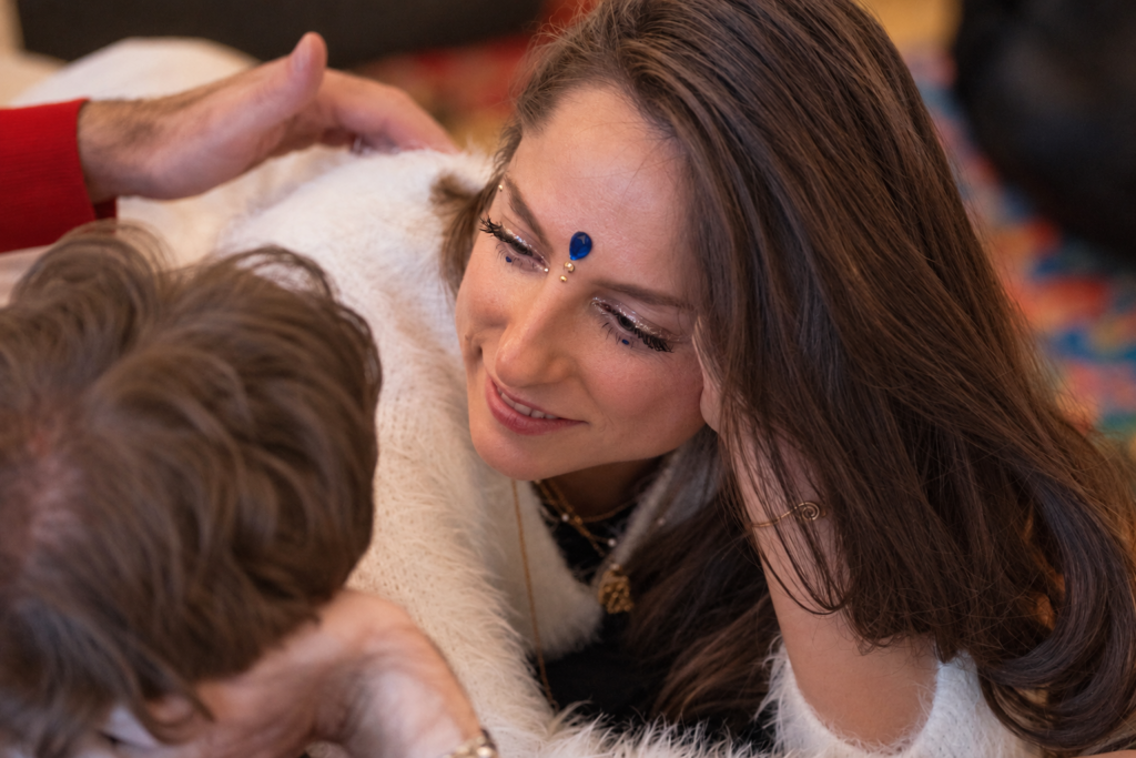 A tender moment of connection between participants at Temple Nights